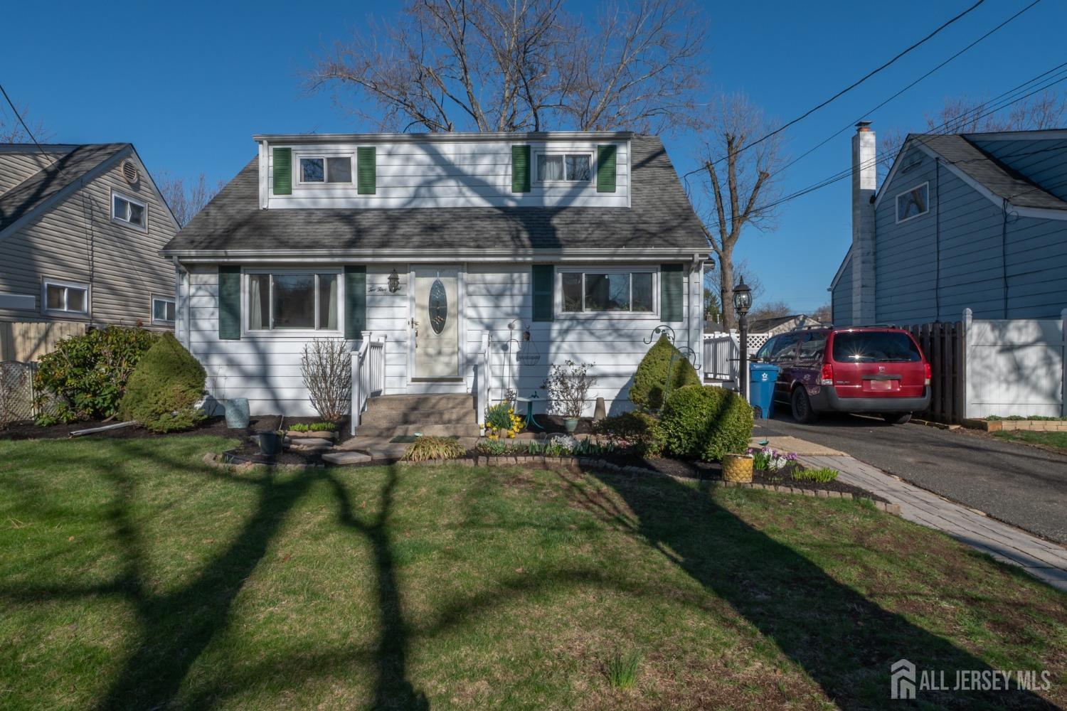 258 Sunset Avenue Old Bridge, NJ 08857 - Photo 2 of 27 a house view with a garden space