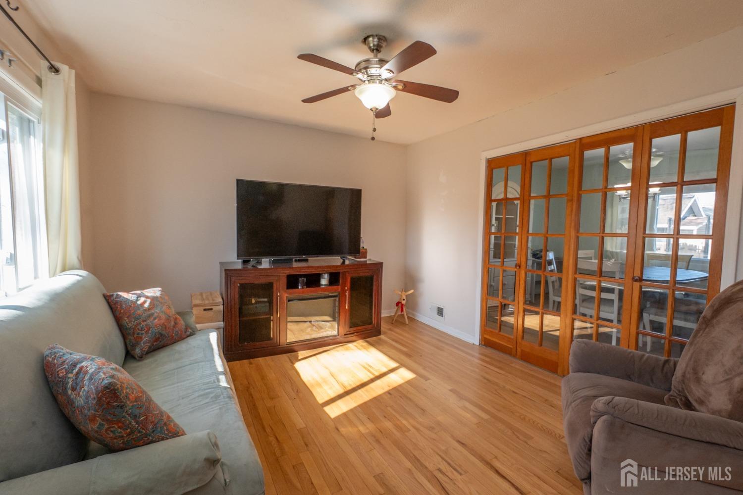258 Sunset Avenue Old Bridge, NJ 08857 - Photo 3 of 27 a living room with furniture and a flat screen tv