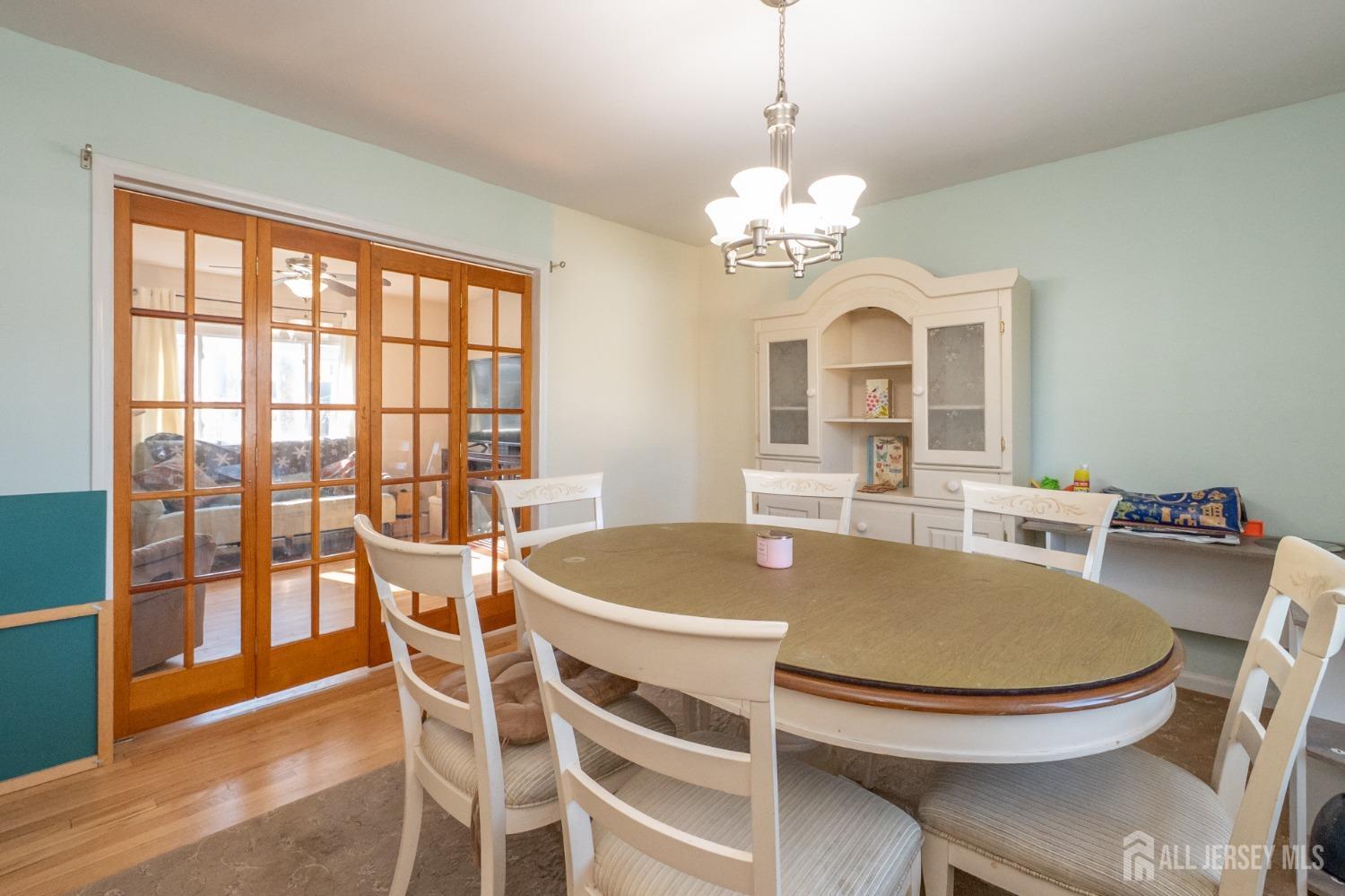 258 Sunset Avenue Old Bridge, NJ 08857 - Photo 7 of 27 a view of a dining room with furniture window and wooden floor