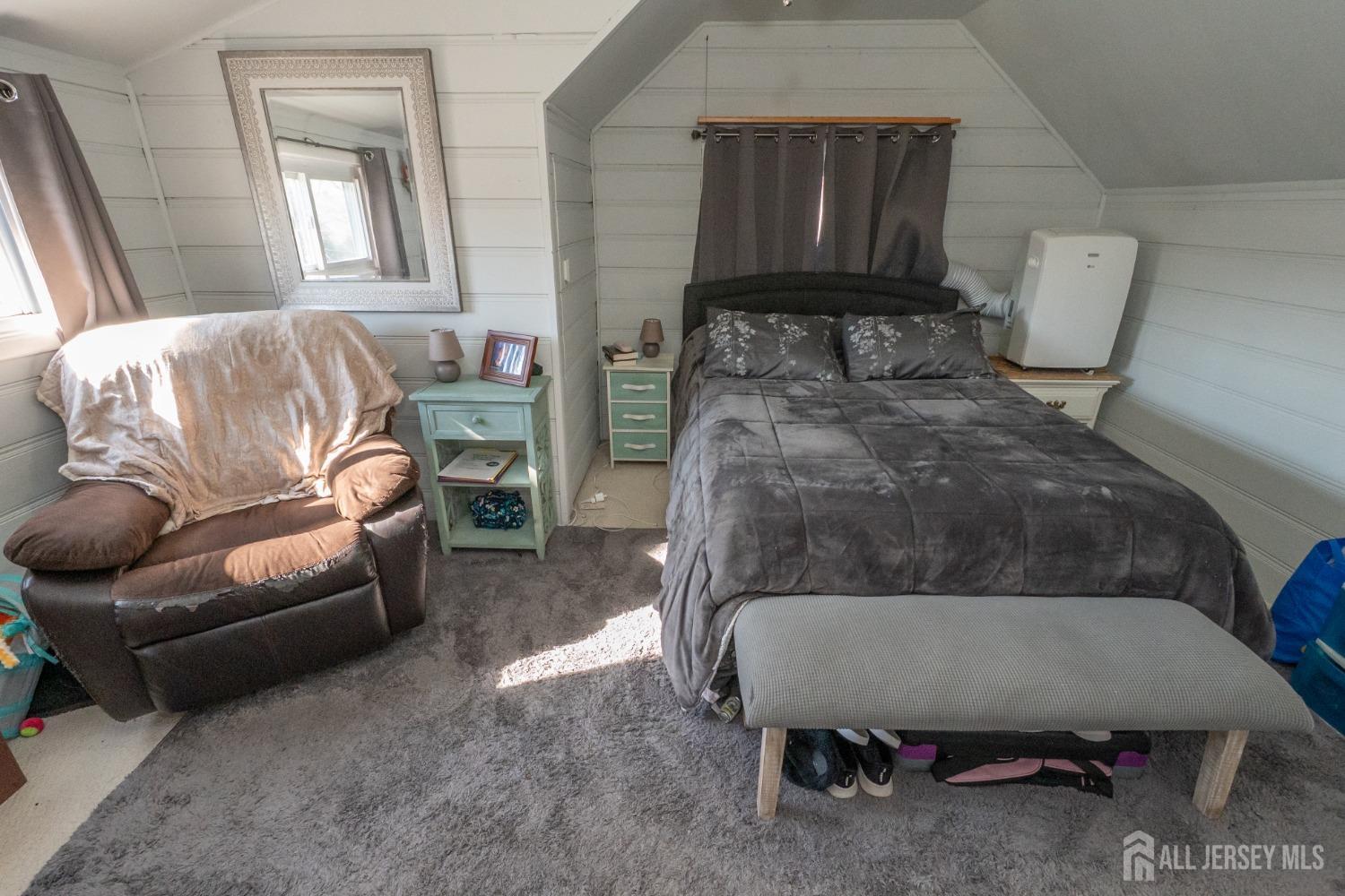 258 Sunset Avenue Old Bridge, NJ 08857 - Photo 10 of 27 a bedroom with a bed a couch and dresser