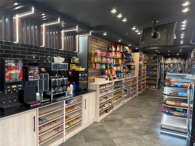 a kitchen with storage and utility