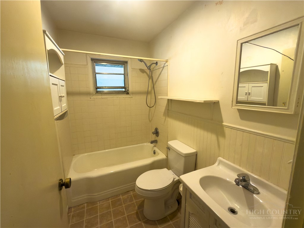 1205 Bamboo Road Boone, NC 28607 - Photo 4 of 17 a bathroom with a sink toilet and shower