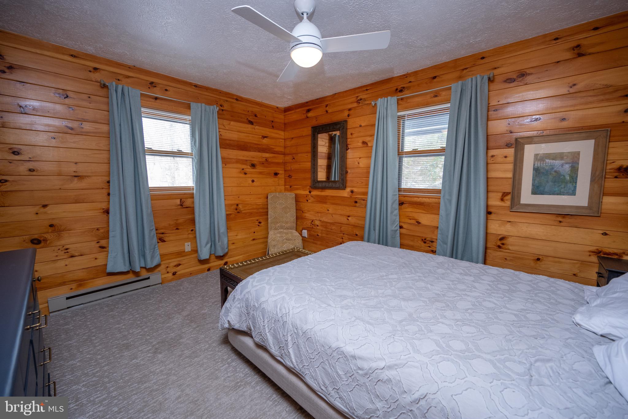 300 Normas Way McHenry, MD 21541 - Photo 17 of 48 a bedroom with a bed and a dresser