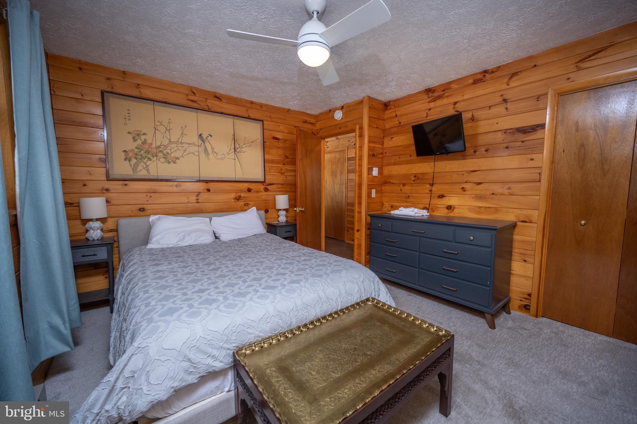 300 Normas Way McHenry, MD 21541 - Photo 18 of 48 a bedroom with a bed and wooden floor