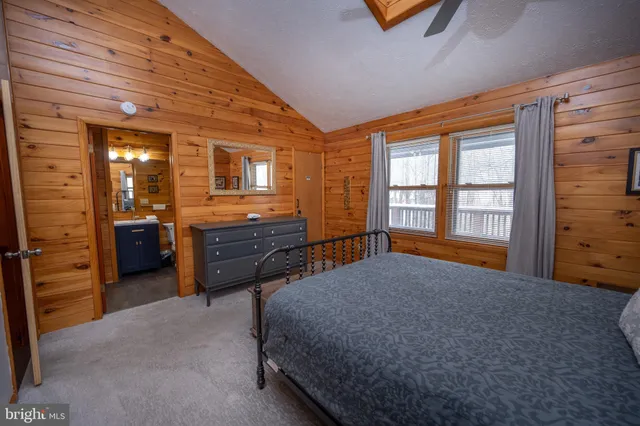 a bed room with a bed and a window