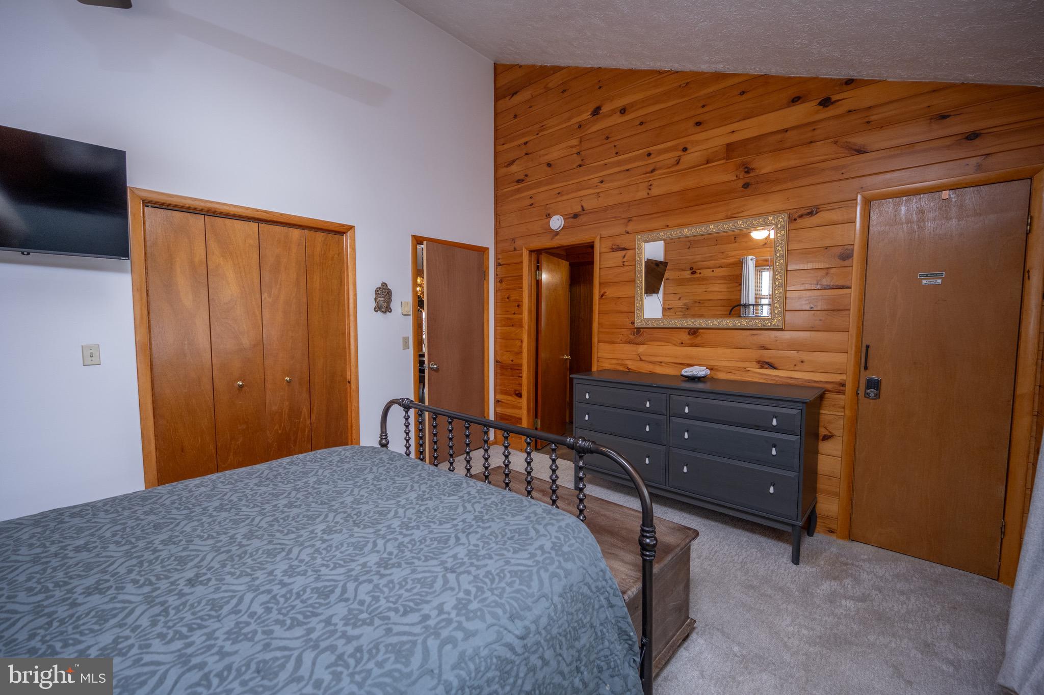 300 Normas Way McHenry, MD 21541 - Photo 22 of 48 a bedroom with a bed and a dresser