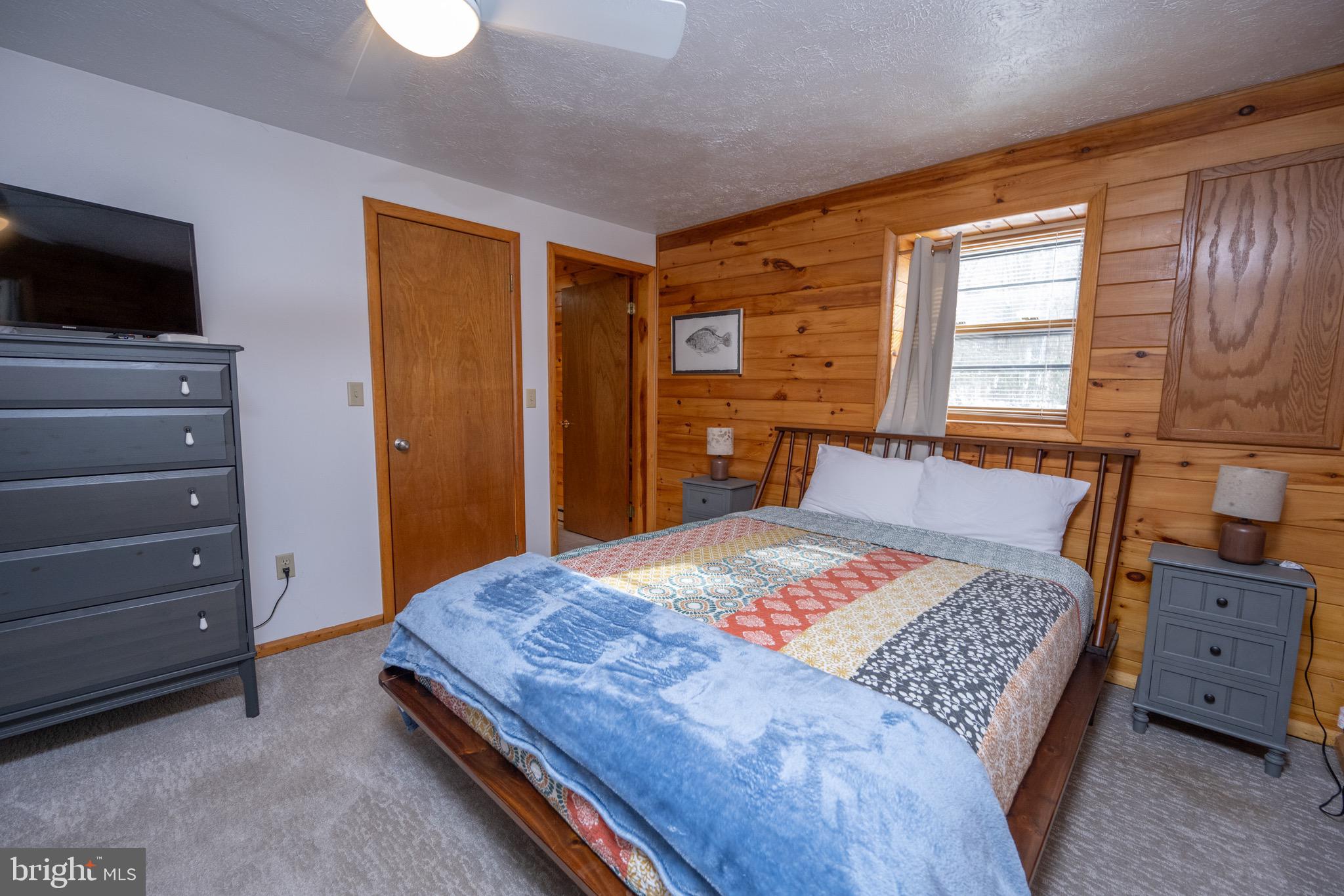 300 Normas Way McHenry, MD 21541 - Photo 33 of 48 a bedroom with a bed and flat screen tv