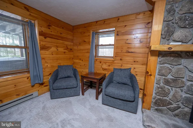 a bathroom with a bathtub and large window
