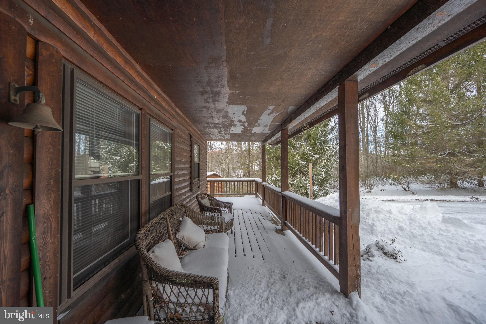 300 Normas Way McHenry, MD 21541 - Photo 43 of 48 a view of a porch with furniture and floor to ceiling window