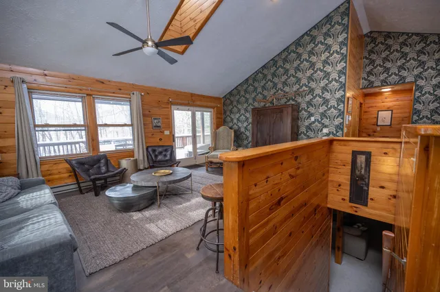 a very nice looking living room with a large window