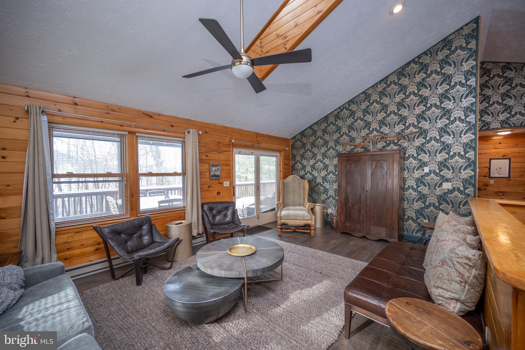 300 Normas Way McHenry, MD 21541 - Photo 10 of 48 a living room with furniture and a floor to ceiling window