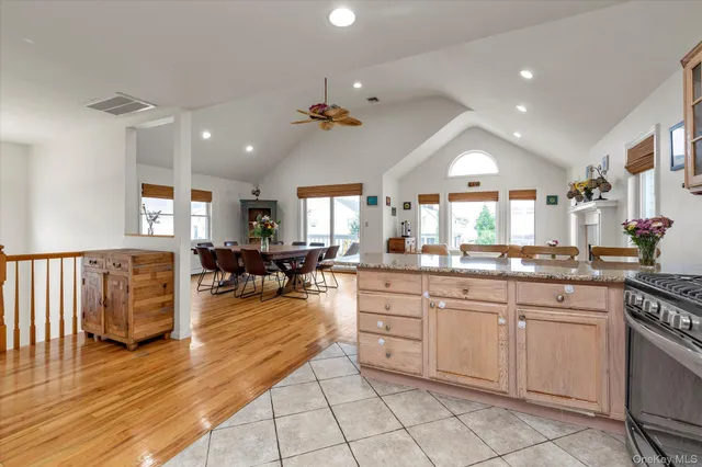 a kitchen with sink cabinets and living room view
