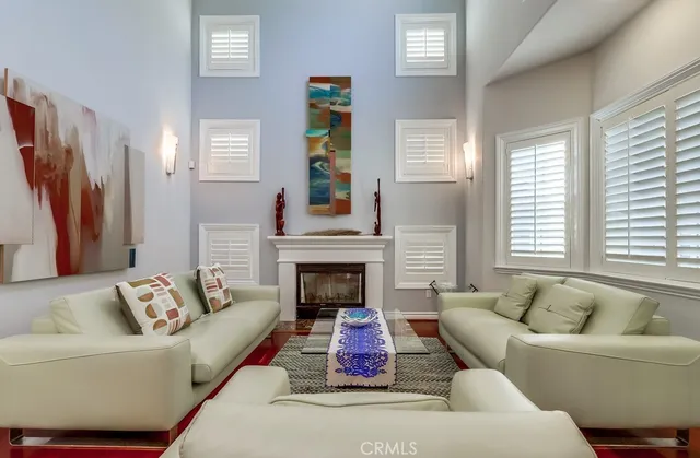 a view of a dining room with furniture wooden floor and a chandelier