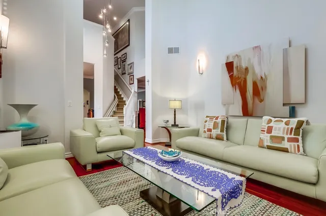 a living room with furniture rug and window
