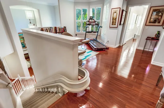 a room with furniture and book shelf