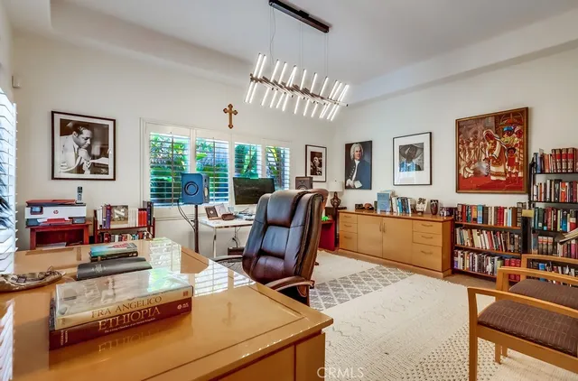 a bedroom with a bed couch and a window