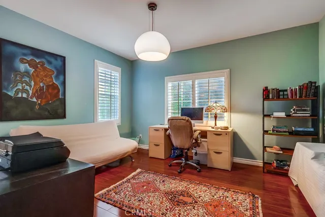 a bathroom with a granite countertop tub sink and mirror