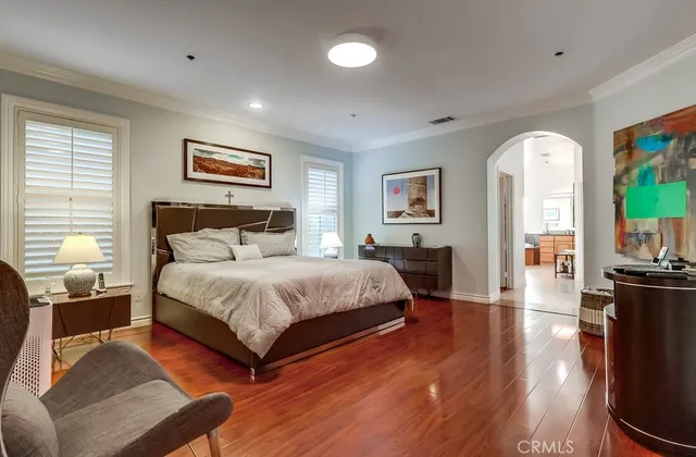 a view of hallway with bathroom and glass door