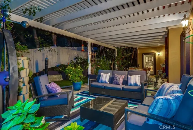 a outdoor living space with furniture and a large window