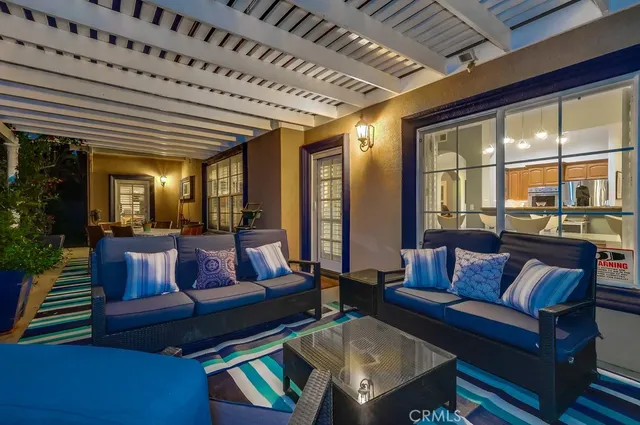 a living room with fireplace furniture and a wooden floor
