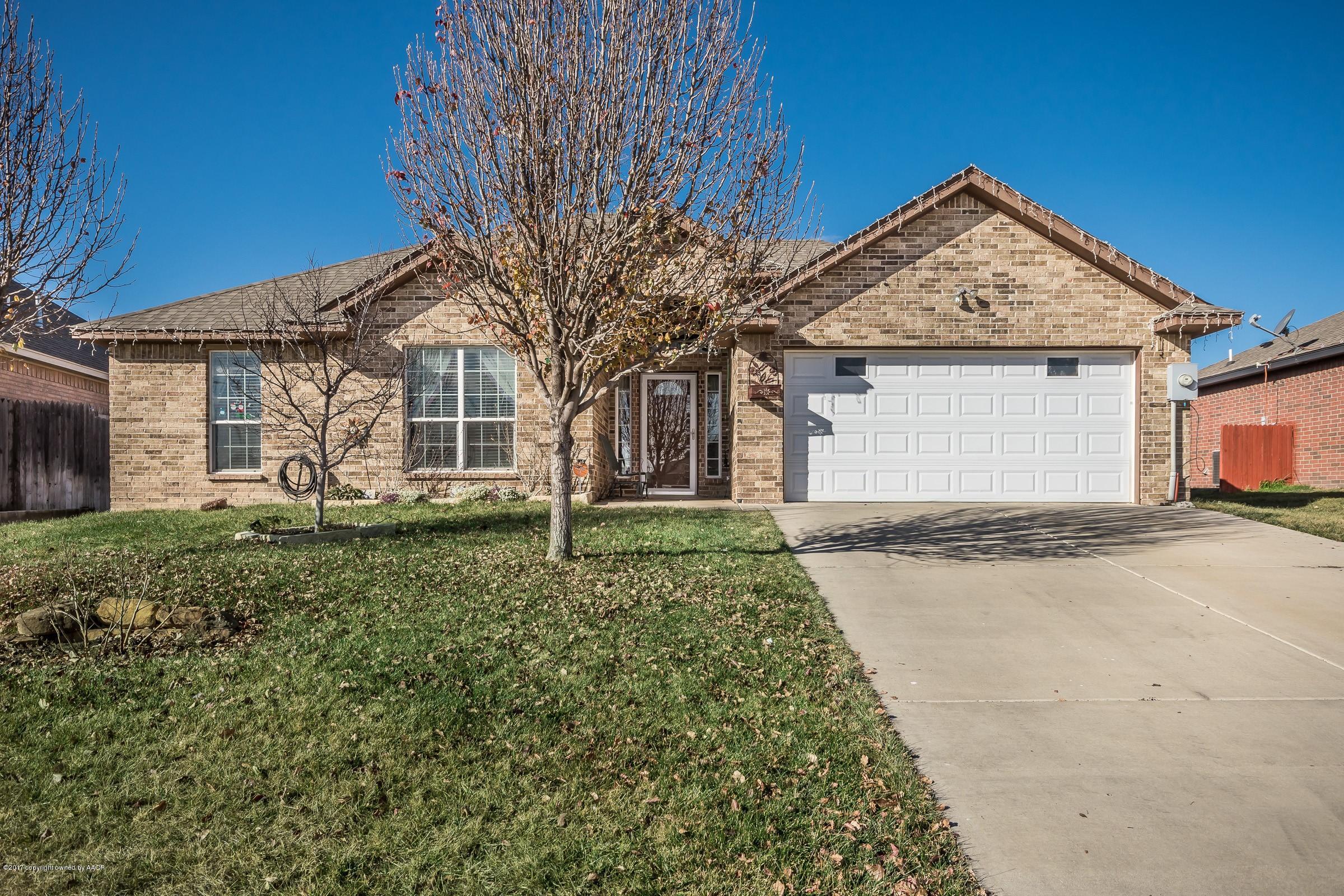 5308 Pleasant Court Amarillo, TX 79110 - Photo 1 of 19 a front view of a house with a yard and garage
