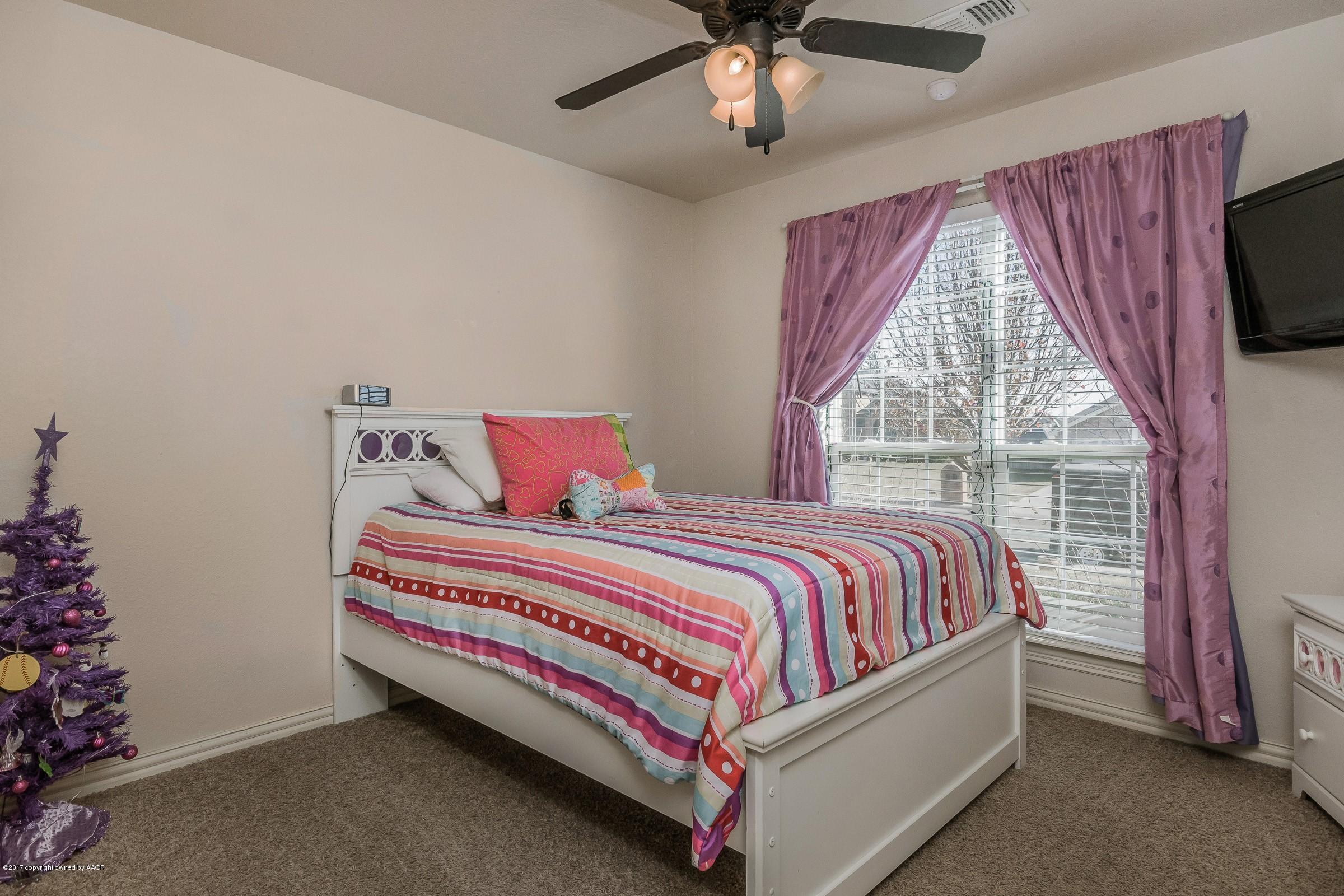 5308 Pleasant Court Amarillo, TX 79110 - Photo 13 of 19 a bed sitting in a bedroom next to a window