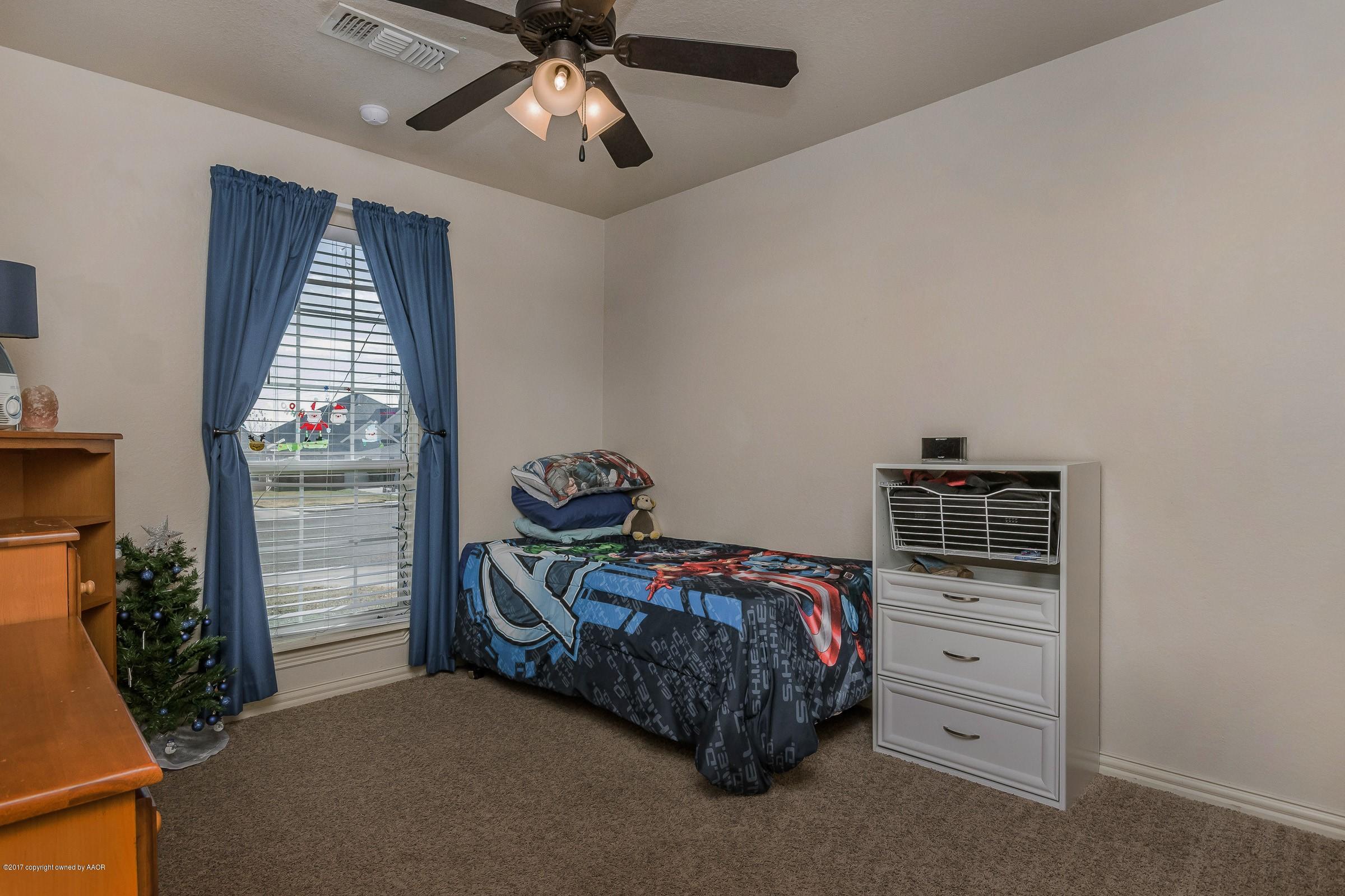5308 Pleasant Court Amarillo, TX 79110 - Photo 15 of 19 a bedroom with a bed and a window