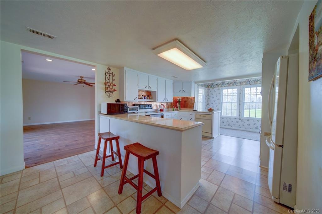 36435 Finger Road Mount Pleasant, NC 28124 - Photo 11 of 37 a kitchen with a sink cabinets and window