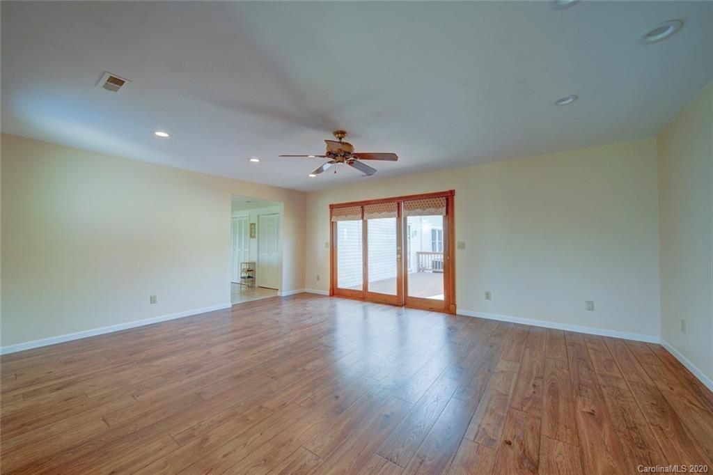 36435 Finger Road Mount Pleasant, NC 28124 - Photo 14 of 37 a view of an empty room with wooden floor and a window