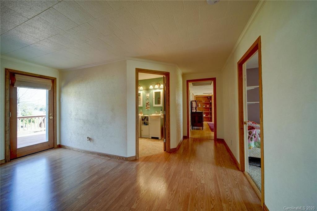 36435 Finger Road Mount Pleasant, NC 28124 - Photo 15 of 37 an empty room with wooden floor and windows