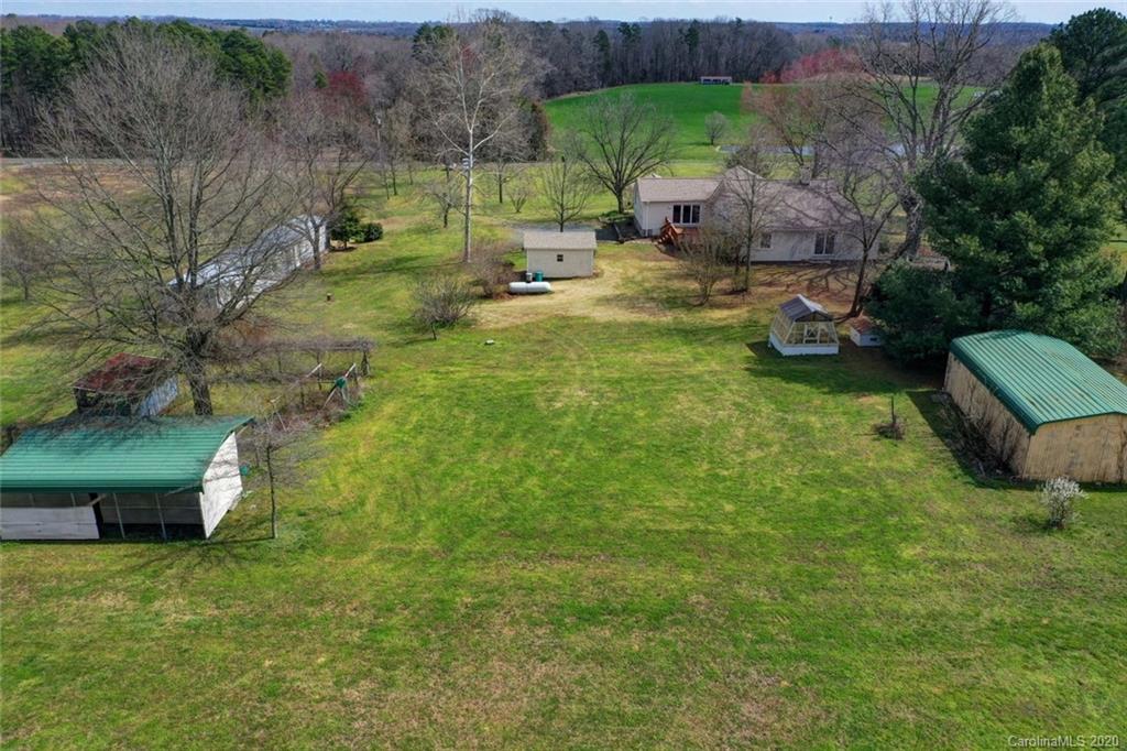 36435 Finger Road Mount Pleasant, NC 28124 - Photo 34 of 37 a backyard of a house with table and chairs