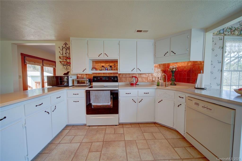 36435 Finger Road Mount Pleasant, NC 28124 - Photo 6 of 37 a kitchen with stainless steel appliances granite countertop a sink and cabinets