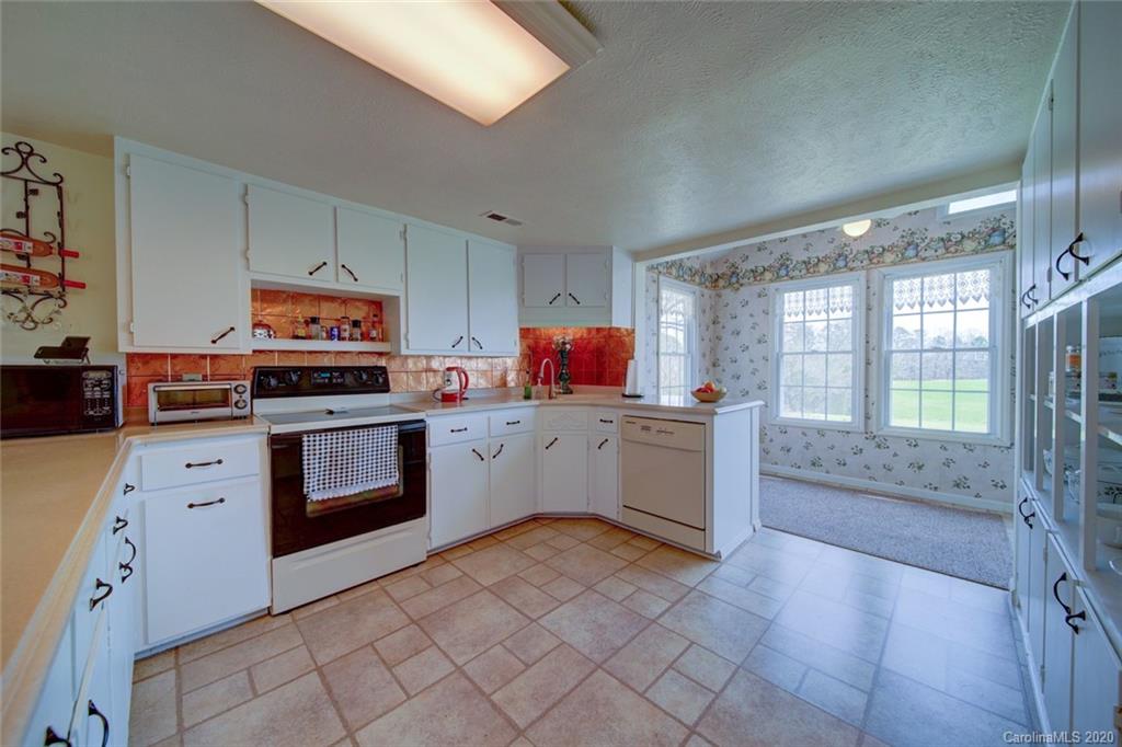 36435 Finger Road Mount Pleasant, NC 28124 - Photo 8 of 37 a kitchen with stainless steel appliances a stove top oven and a refrigerator