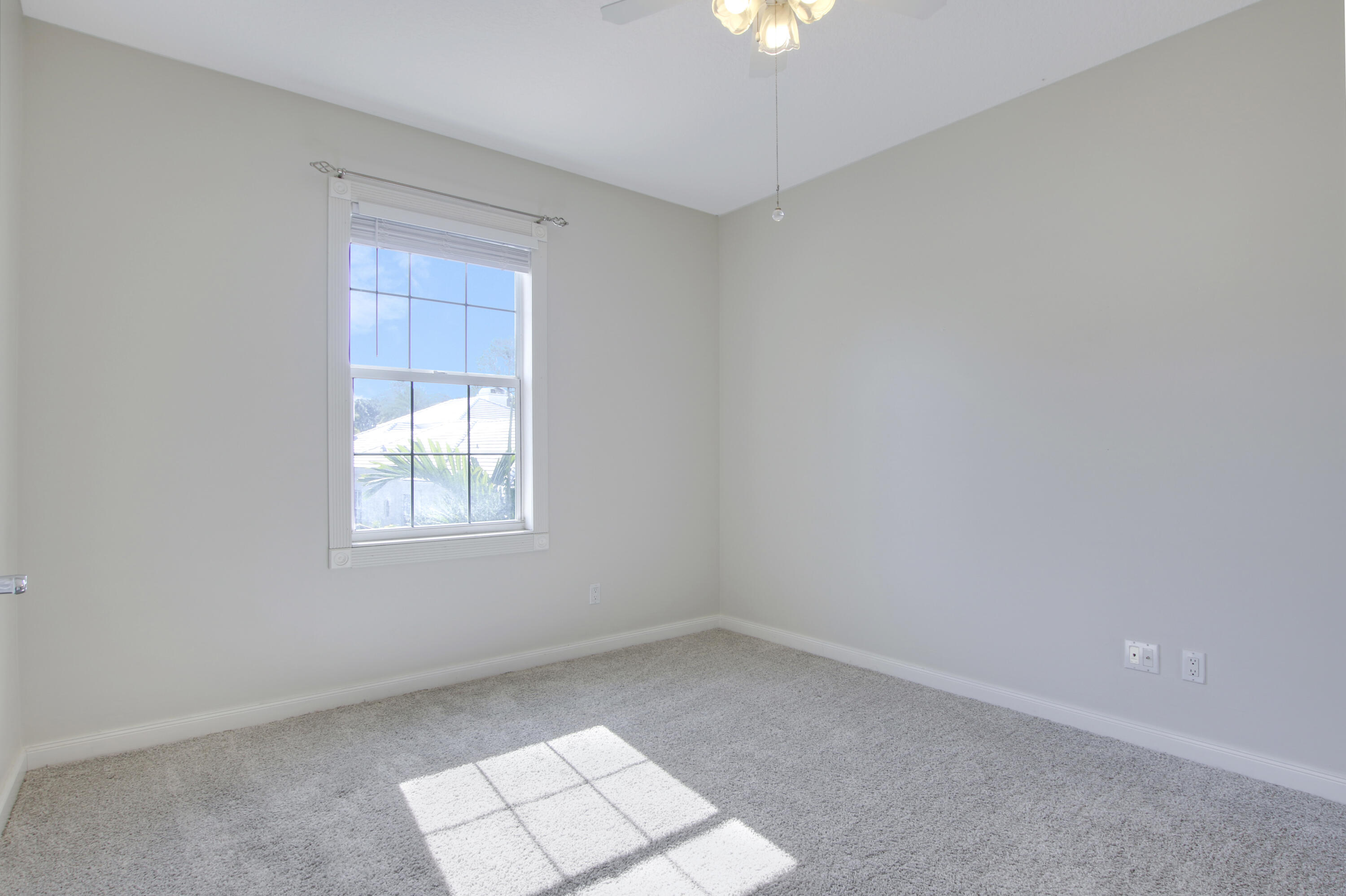 3057 East Community Drive Jupiter, FL 33458 - Photo 16 of 23 an empty room with a window