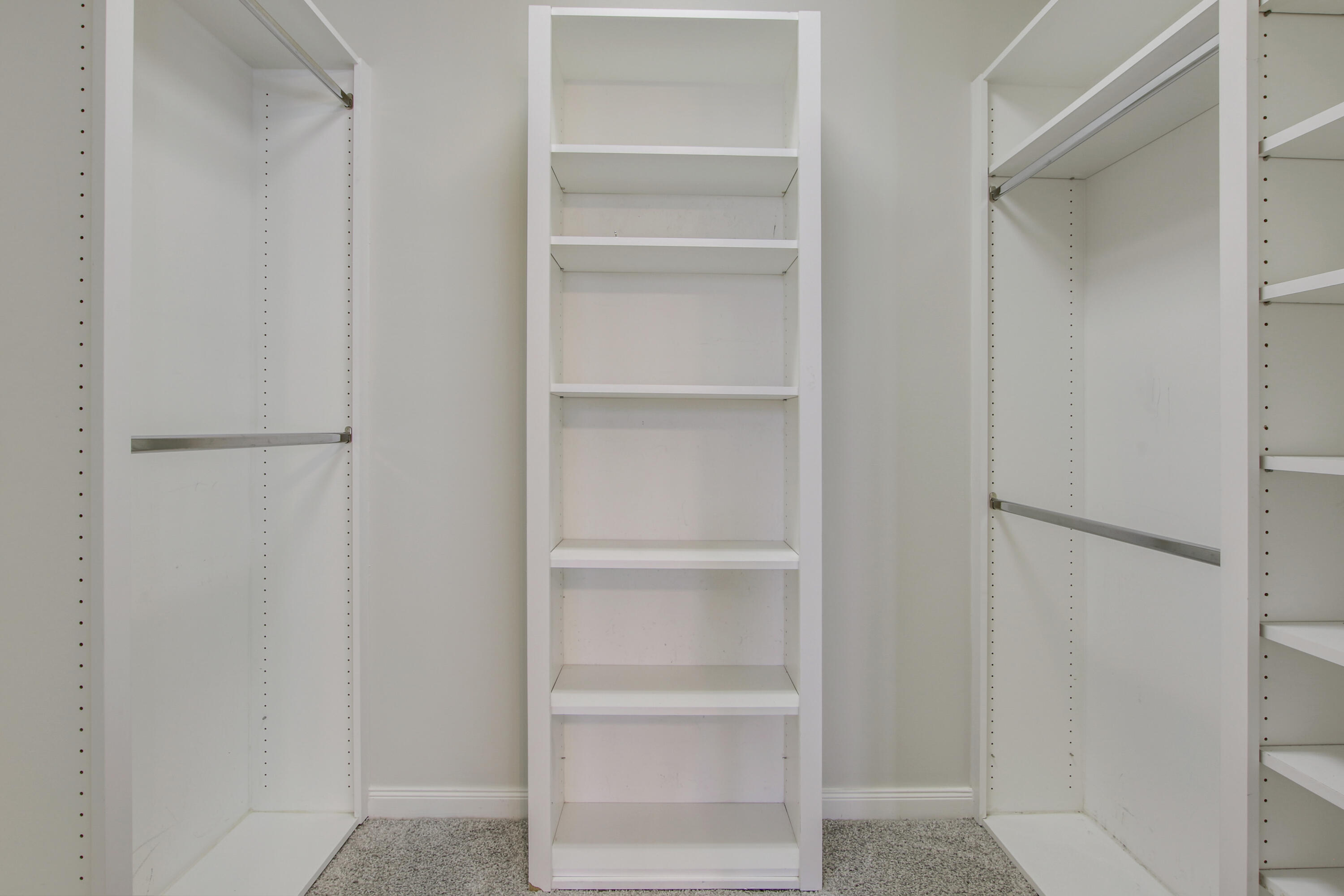 3057 East Community Drive Jupiter, FL 33458 - Photo 23 of 23 a view of walk in closet with empty racks