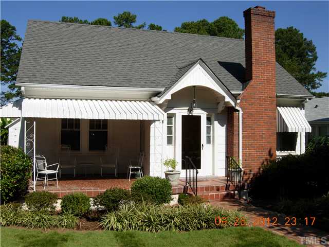 309 Hudson Street Raleigh, NC 27608 - Photo 1 of 17 a front view of a house with a yard