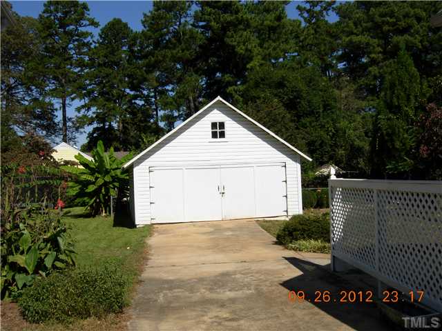 309 Hudson Street Raleigh, NC 27608 - Photo 14 of 17 a front view of a house with a yard