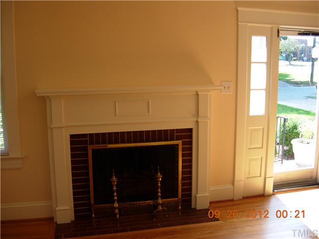 309 Hudson Street Raleigh, NC 27608 - Photo 2 of 17 a living room with furniture and a fireplace
