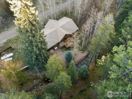 a view of a house in a forest