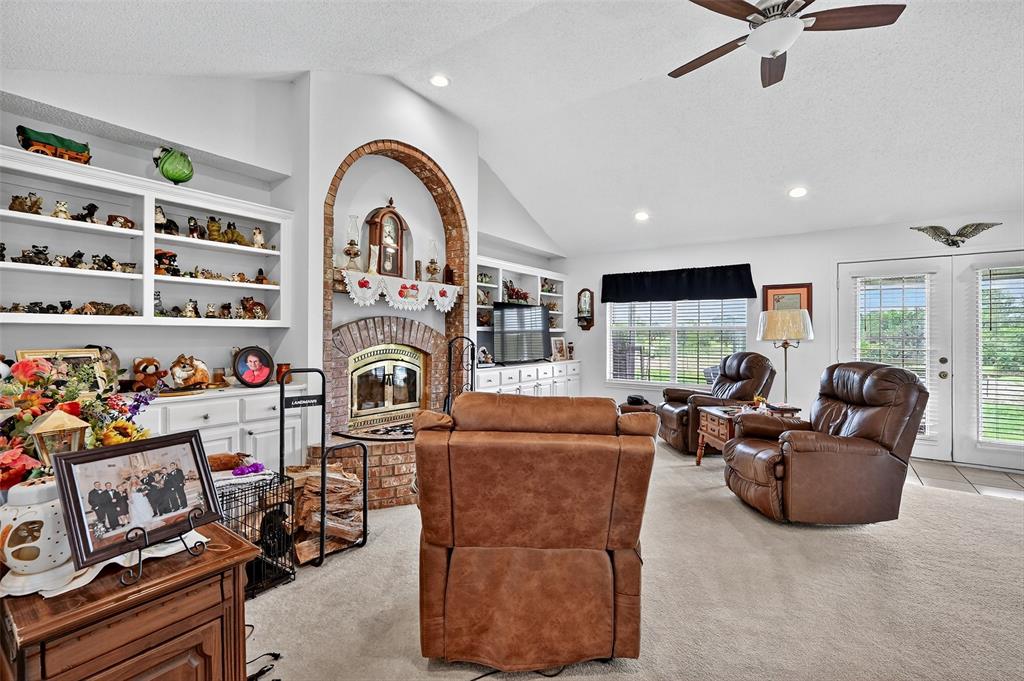929 County Line Church Road Whitesboro, TX 76273 - Photo 12 of 38 a living room with furniture and a flat screen tv