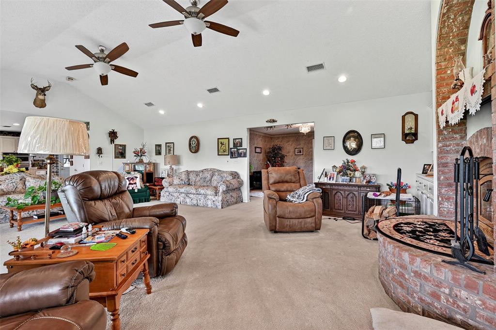 929 County Line Church Road Whitesboro, TX 76273 - Photo 14 of 38 a living room with furniture and a fireplace