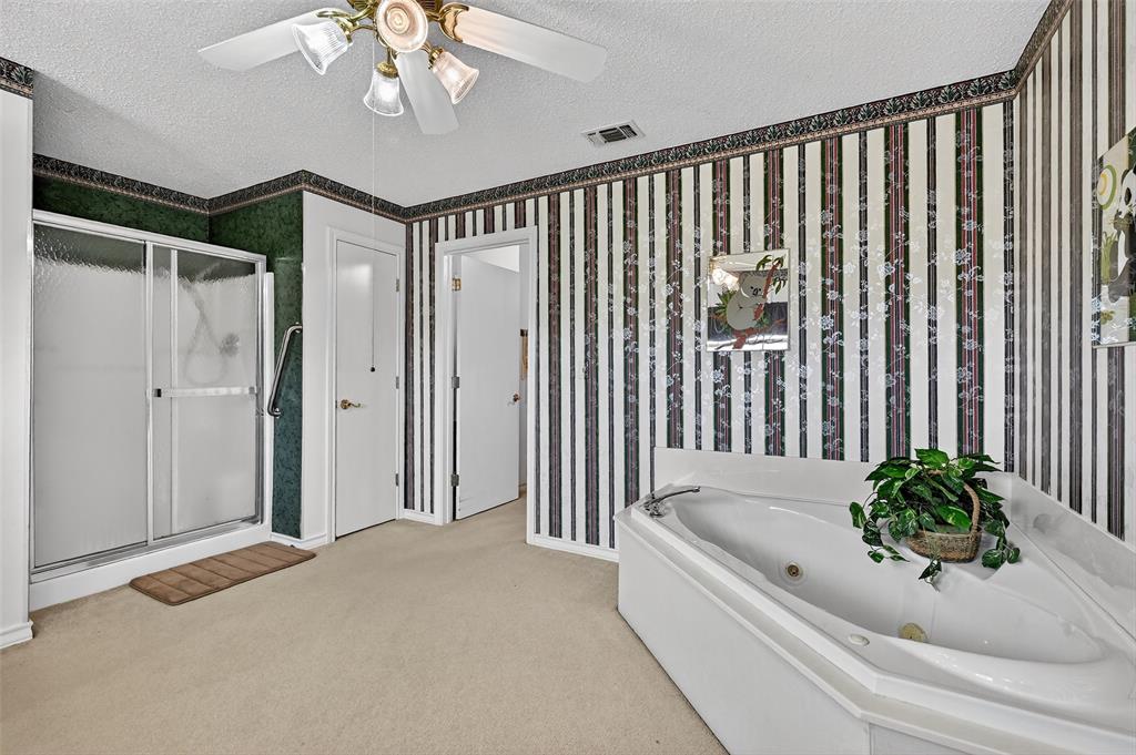 929 County Line Church Road Whitesboro, TX 76273 - Photo 27 of 38 a bathroom with a bathtub and shower