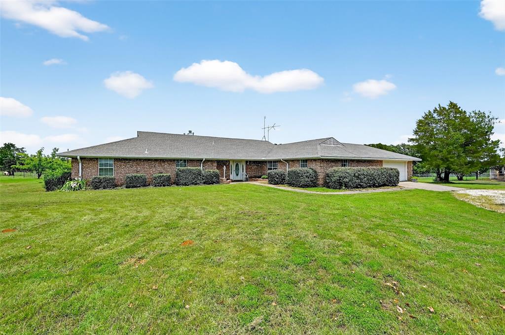 929 County Line Church Road Whitesboro, TX 76273 - Photo 7 of 38 a view of a house with a yard and a fountain