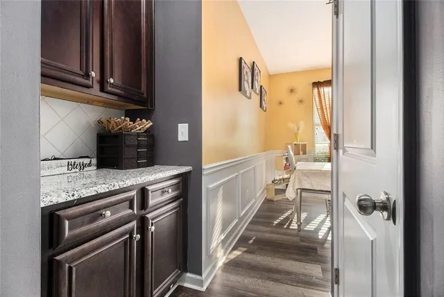 a kitchen with a refrigerator and a sink