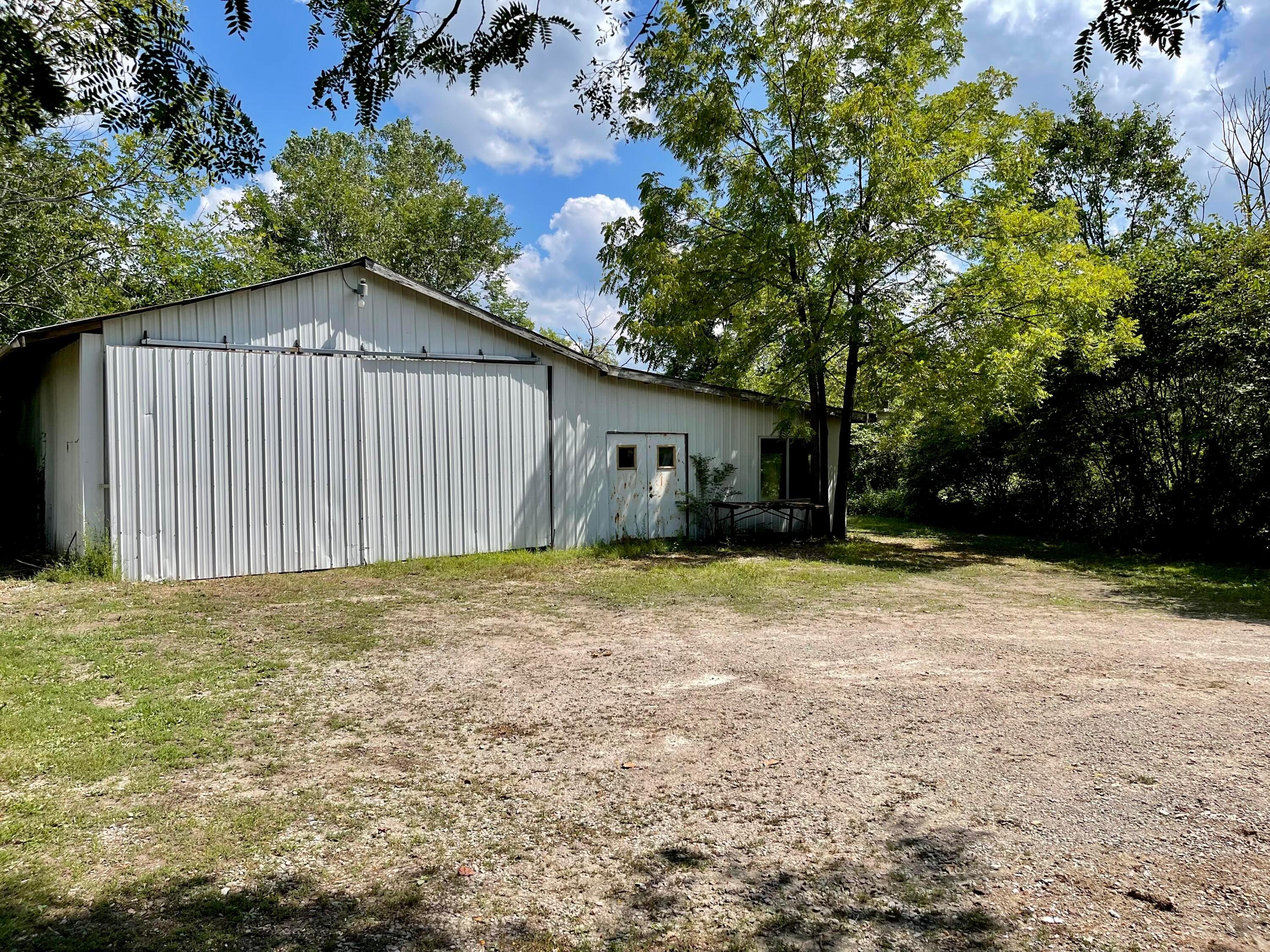 10671 Co Road East Liberty, OH 43319 - Photo 15 of 37 Barn with three car bays on the right