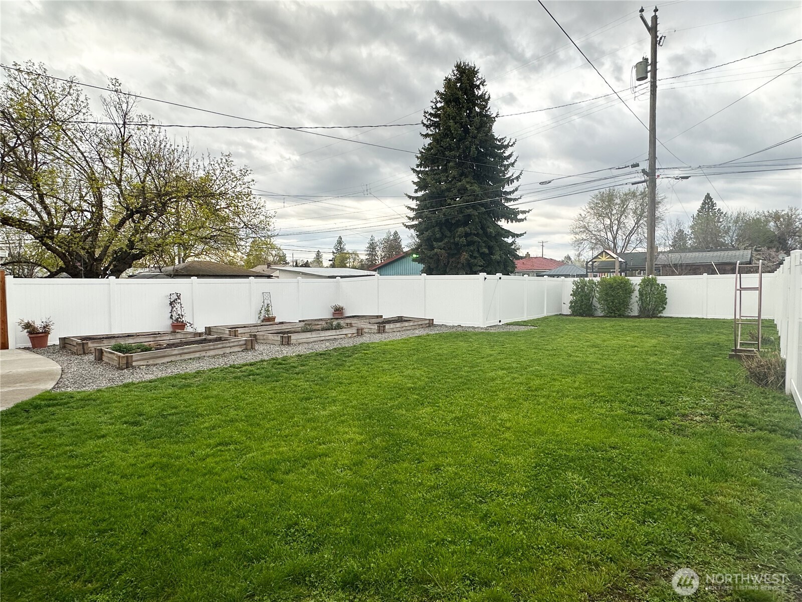 611 East Joseph Avenue Spokane, WA 99208 - Photo 22 of 29 a view of a green field with covered in the background