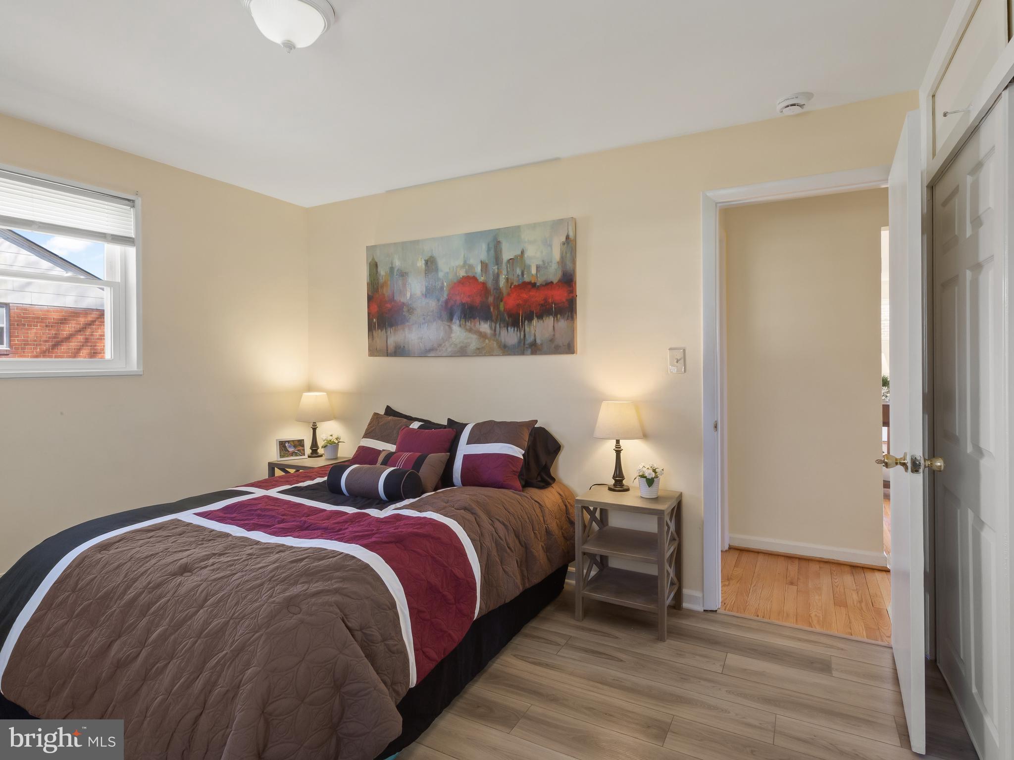 3405 Fredale Street Silver Spring, MD 20906 - Photo 11 of 34 a bed room with a bed and a painting on the wall