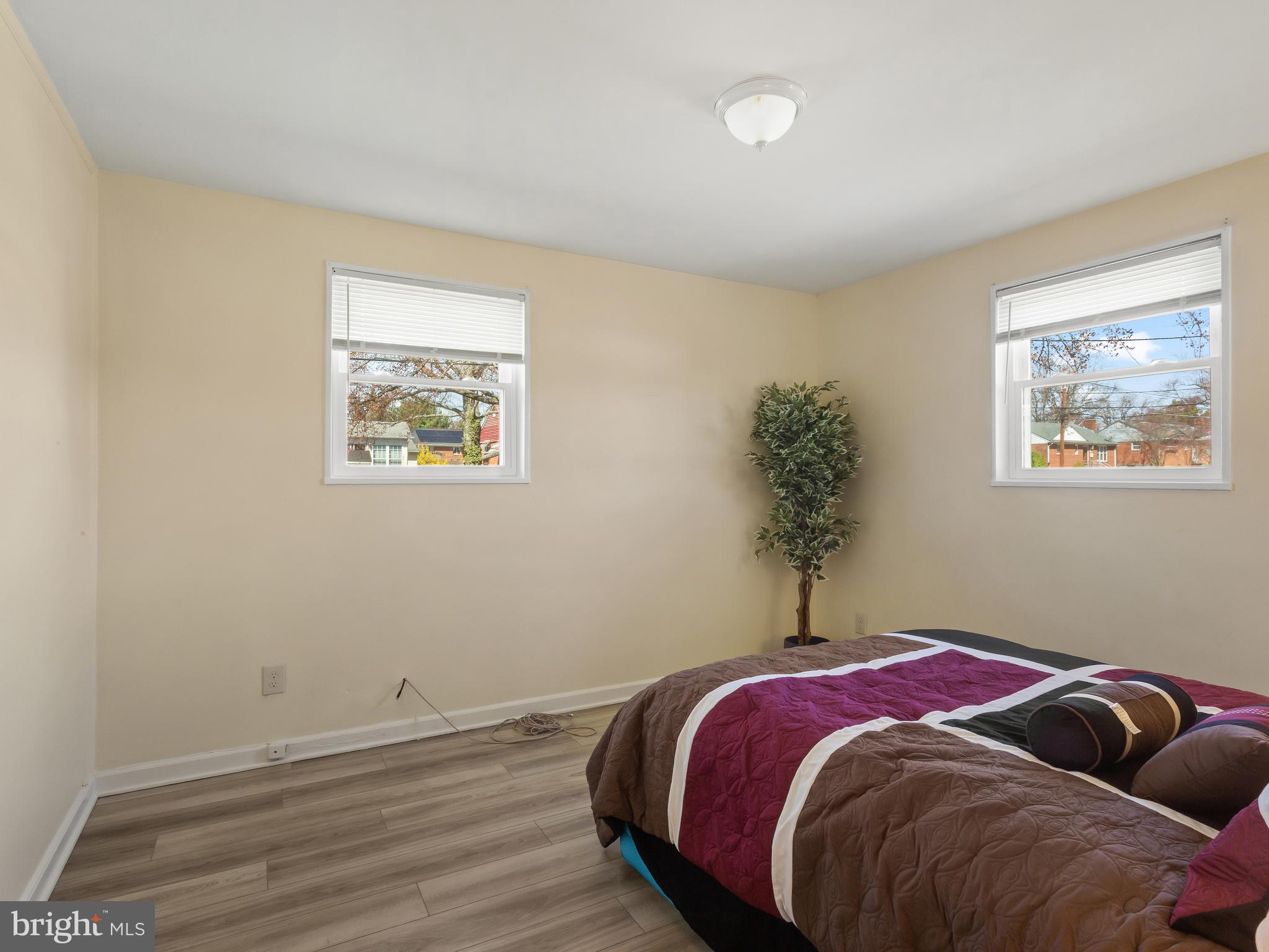 3405 Fredale Street Silver Spring, MD 20906 - Photo 12 of 34 a bed sitting in a bedroom next to a window