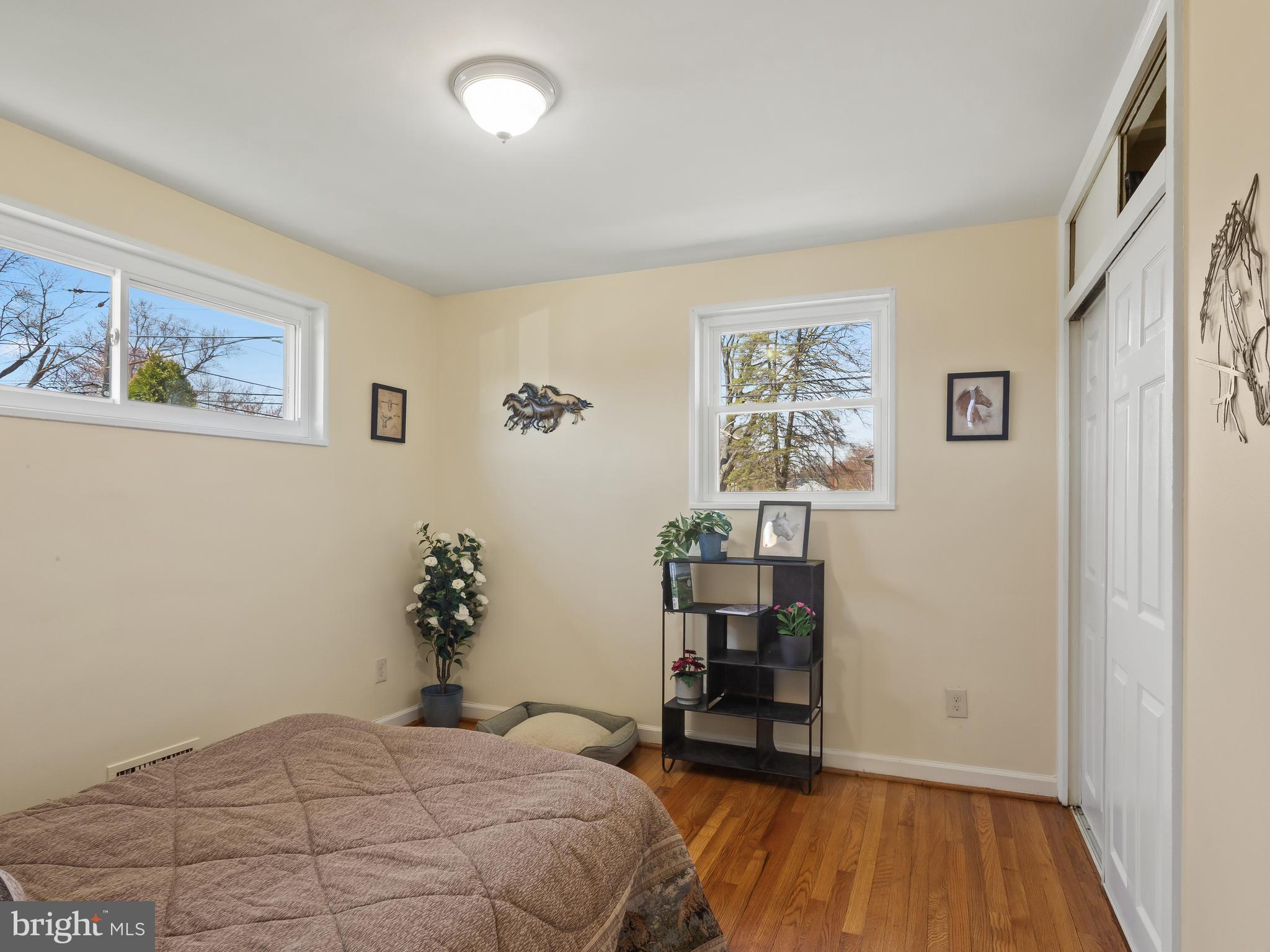 3405 Fredale Street Silver Spring, MD 20906 - Photo 13 of 34 a bedroom with a bed and wooden floor