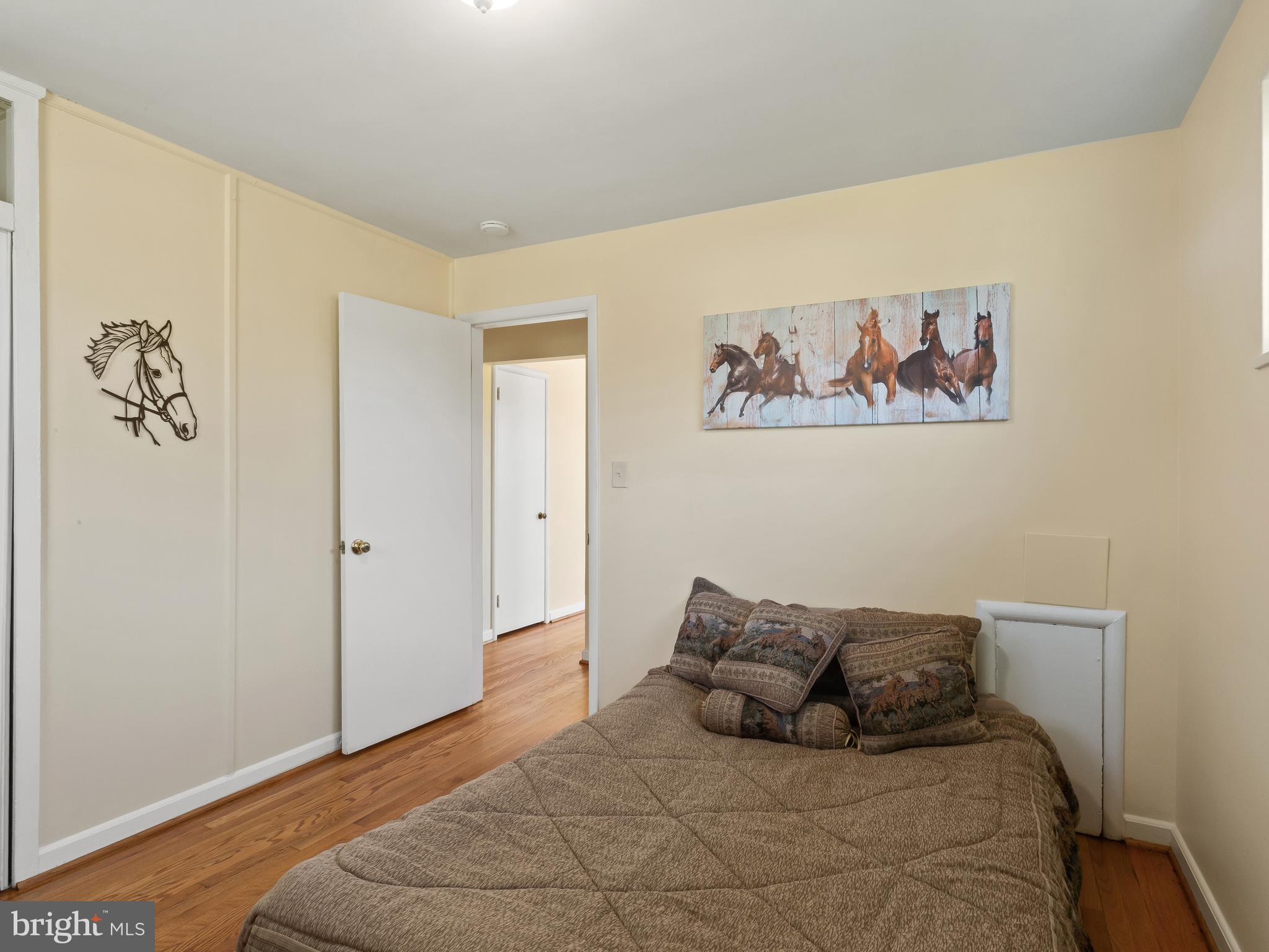 3405 Fredale Street Silver Spring, MD 20906 - Photo 14 of 34 a bedroom with a bed and painting on the wall